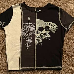 A cropped medium sized shirt from Hollister in white, grey and black w/ graphics